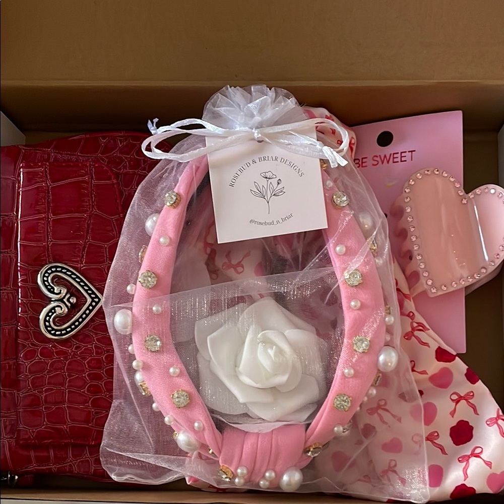 99. “Heart Felt” Rosebud gift box filled with pink and Red accessories